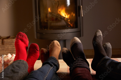 Photo: Close Up Of Familys Feet Relaxing By Cosy Log Fire With Marshmal Close Up Of Familys Feet Relaxing By Cosy Log Fire With Marshmal
