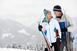 Middle Aged Couple On Ski Holiday In Mountains