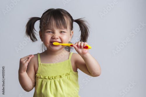 Photo: Girl brushing teeth Girl brushing teeth