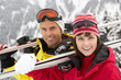 Photo: Middle Aged Couple On Ski Holiday In Mountains Middle Aged Couple On Ski Holiday In Mountains