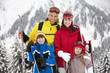 Family On Ski Holiday In Mountains
