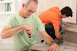 Father and son putting together flatpack furniture