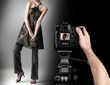 professional photographer at studio fashion shot with a model.