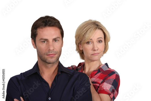 Photo: Couple looking disappointed Couple looking disappointed