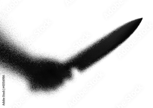 Photo: Knife in a hand. Silhouette. Photographed through the textured g Knife in a hand. Silhouette. Photographed through the textured g