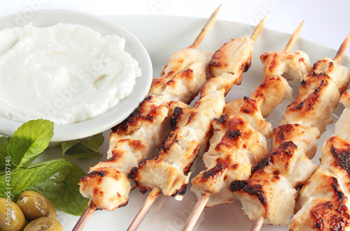 Photo: Shish taouk - Chicken shish kebab on white platter Shish taouk - Chicken shish kebab on white platter