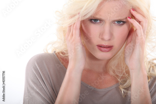 Foto: Blonde woman with a headache Blonde woman with a headache