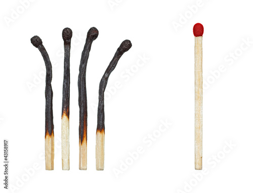 Photo: burnt matches and a whole match burnt matches and a whole match