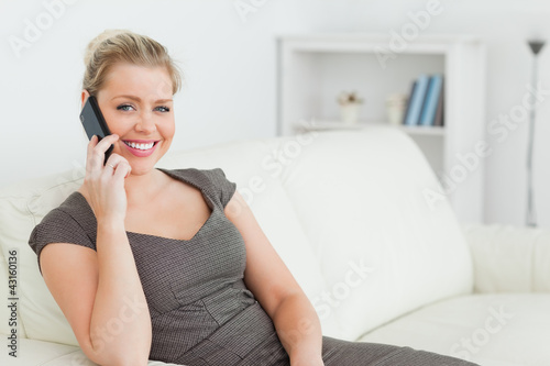 Photo: Woman calling with her mobile phone Woman calling with her mobile phone