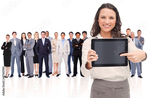 Photo: Woman showing a screen Woman showing a screen