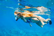 Woman Snorkeling in Tropical Ocean
