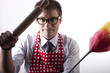 Young man with duster and kitchen tool