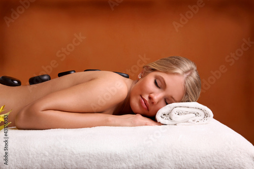 Photo: Portrait of young beautiful woman in spa environment. Portrait of young beautiful woman in spa environment.