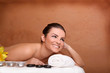 Photo: Portrait of young beautiful woman in spa environment Portrait of young beautiful woman in spa environment