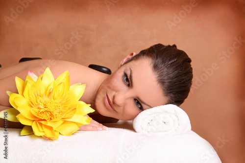 Photo: Portrait of young beautiful woman in spa environment. Portrait of young beautiful woman in spa environment.