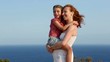 Family happy greeting goodbye in blue sea background