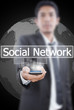 Businessman Holding mobile with Social Network word.