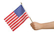 Hand holding american flag on white