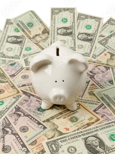 Photo: Piggy bank on dollar bills Piggy bank on dollar bills