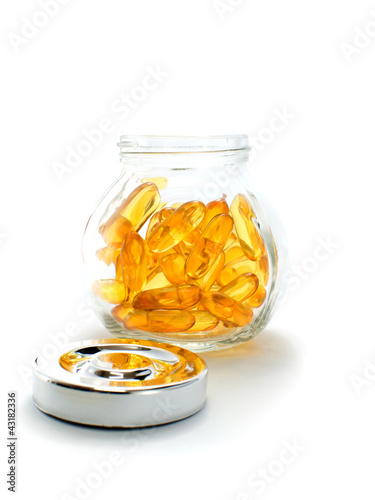 Photo: Fish oil capsules and container Fish oil capsules and container