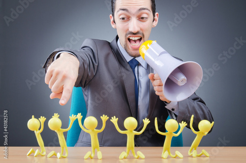 Foto: Boss with figures of his subordinates Boss with figures of his subordinates