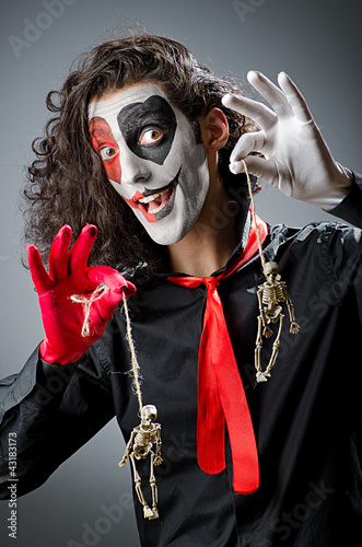 Photo: Joker with face mask in studio Joker with face mask in studio