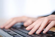 Foto: Hands typing on the keyboard Hands typing on the keyboard