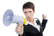 Young business lady screaming to loudspeaker