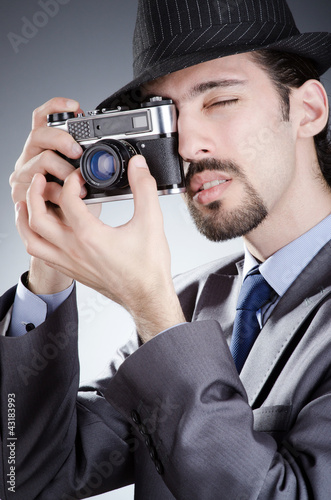 Photo: Photographer man with vintage camera Photographer man with vintage camera