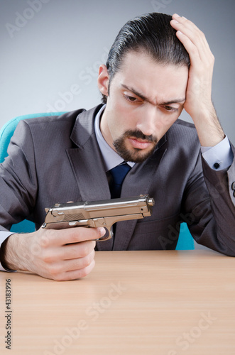 Photo: Businessman man with hand gun Businessman man with hand gun