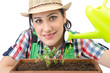 Girl watering plants on white