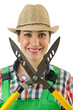 Girl with garden scissors on white