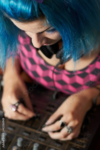 Photo: Punk girl DJ with dyed turqouise hair Punk girl DJ with dyed turqouise hair