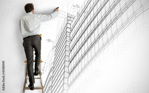 Photo: Architect drawing a project Architect drawing a project