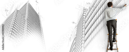 Foto: Architect drawing a project Architect drawing a project