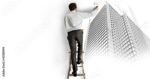 Photo: Architect drawing a project Architect drawing a project