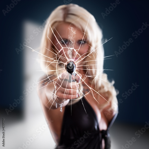 Photo: sexy girl holding gun sexy girl holding gun