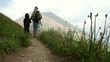 Son and father walking in the high Alps mountains
