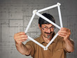 man with folding rule in the shape of a house