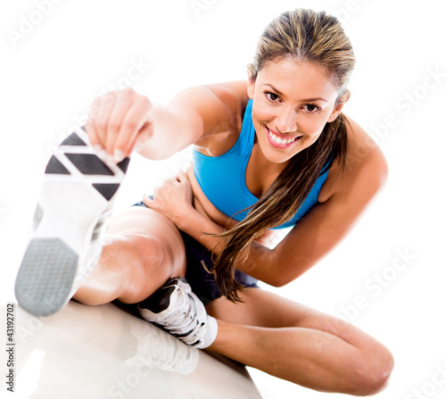 Photo: Woman stretching her leg Woman stretching her leg