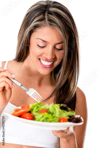 Photo: Woman eating a healthy salad Woman eating a healthy salad