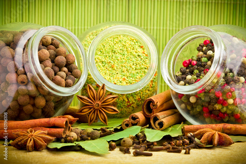 Photo: Pack of several spices and herbs in glass jars Pack of several spices and herbs in glass jars