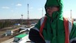 Worker on a top of a huge oil tank (fisheye).