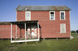 Photo: Deserted red house sitting along the road on Route 13 of the Eastern Shore of Maryland Deserted red house sitting along the road on Route 13 of the Eastern Shore of Maryland