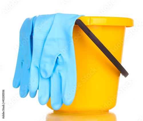 Photo: Bucket and gloves for cleaning isolated on white Bucket and gloves for cleaning isolated on white