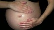 Video: Pregnant woman apply body lotion to her belly Pregnant woman apply body lotion to her belly