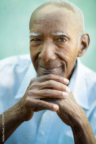 Photo: Closeup of happy old black man smiling at camera Closeup of happy old black man smiling at camera