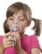 ill little girl with inhaler - respiratory problems