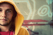 Photo: Young man portrait on graffiti grunge wall Young man portrait on graffiti grunge wall