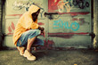 Photo: Young man portrait on graffiti grunge wall Young man portrait on graffiti grunge wall